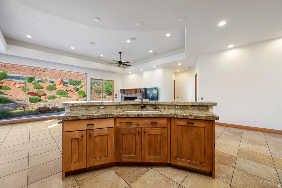 Built-in bar with stone countertop and integrated sink