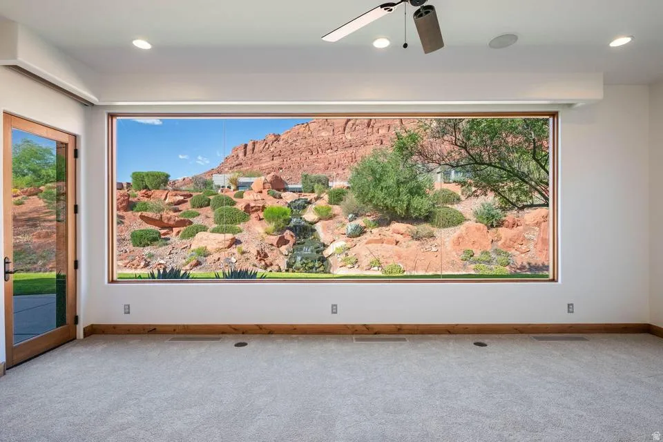 Expansive picture window showcasing a natural rock landscape