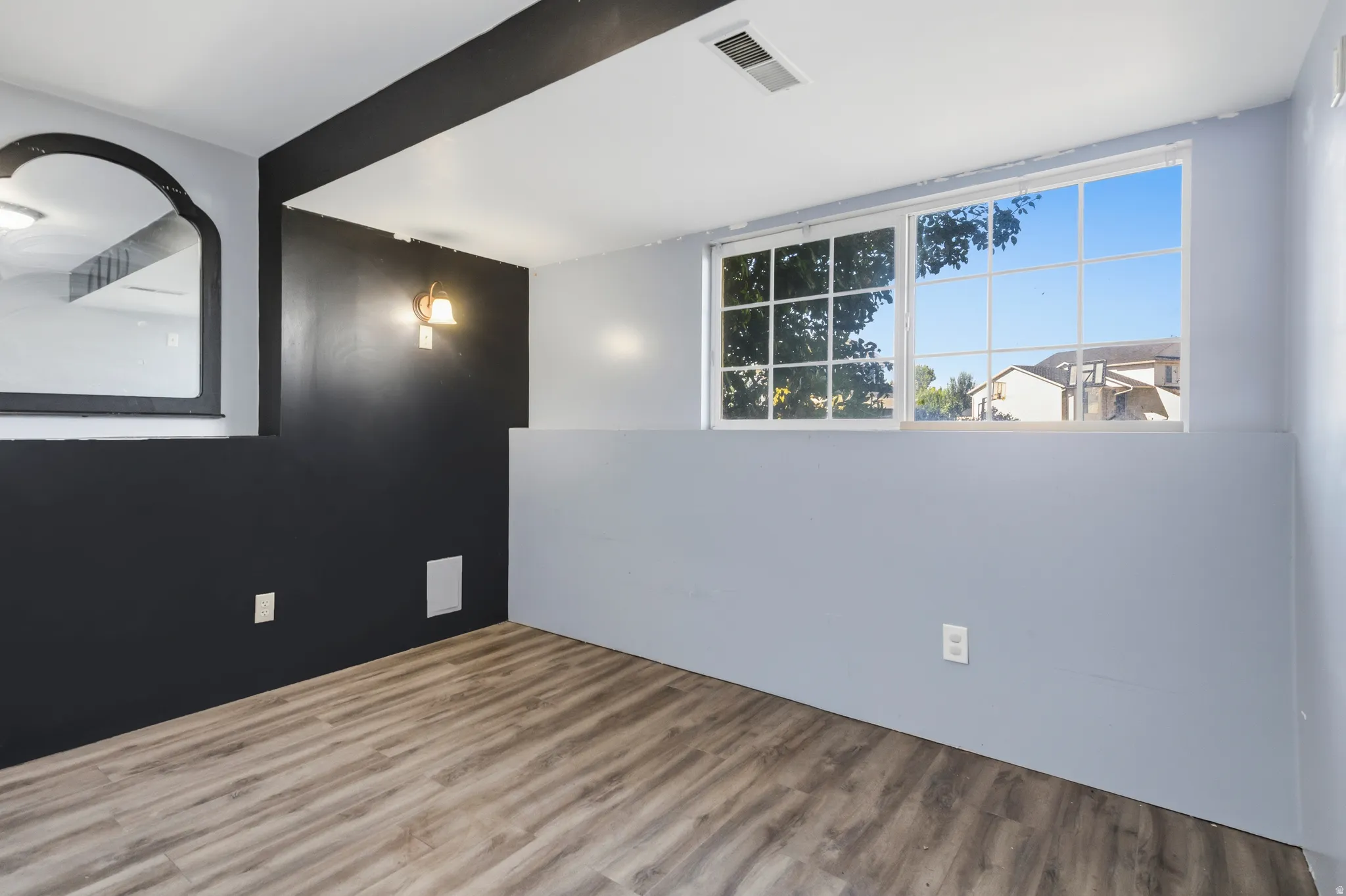 Wood-finish flooring with a contrasting two-tone wall treatment