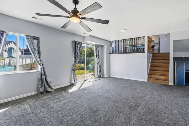 Recessed lighting, ceiling fan, and carpeted flooring