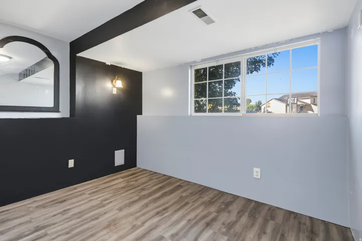 Wood-finish flooring with a contrasting two-tone wall treatment