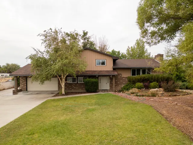 Brick and stone exterior with two-story architecture and attached garage