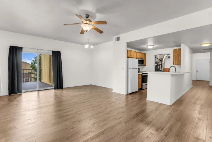 Open family room with wood laminate flooring