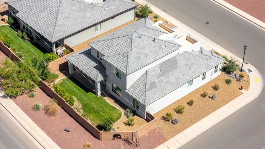 Contemporary residence with a multi-level roofline, stucco exterior, and attached covered patio