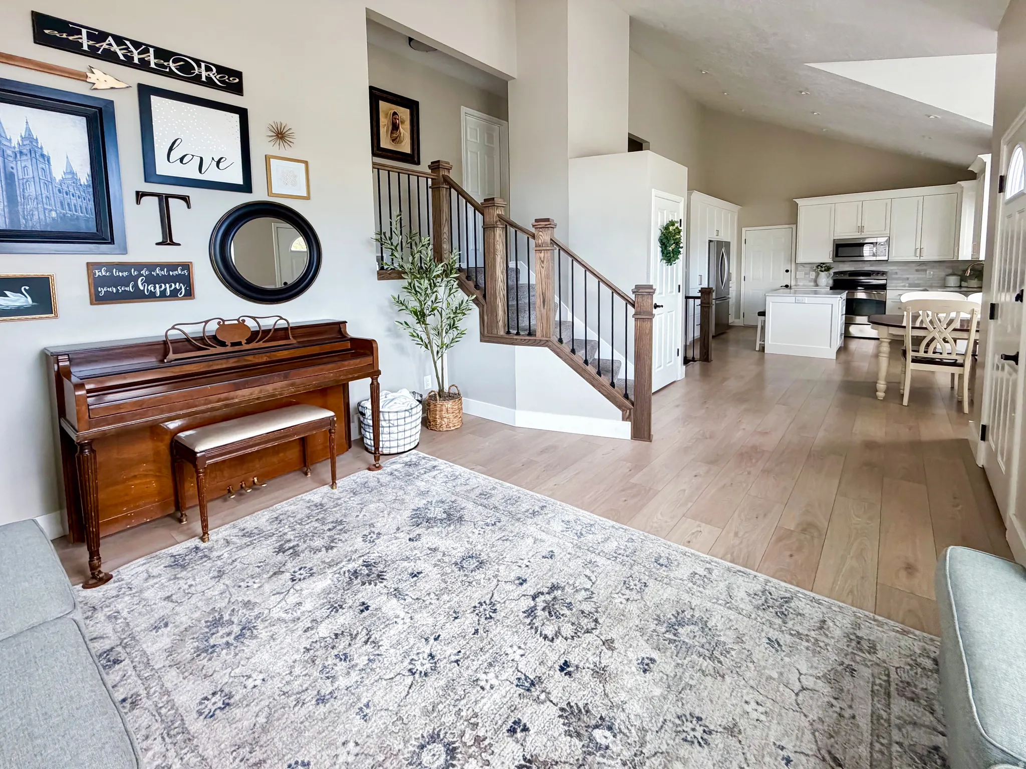 Vaulted ceilings complement the light wood-finish flooring