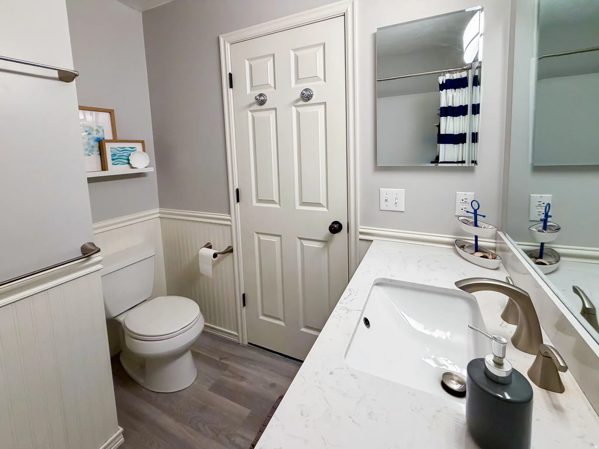 Quartz countertop with integrated rectangular sink and brushed nickel faucet