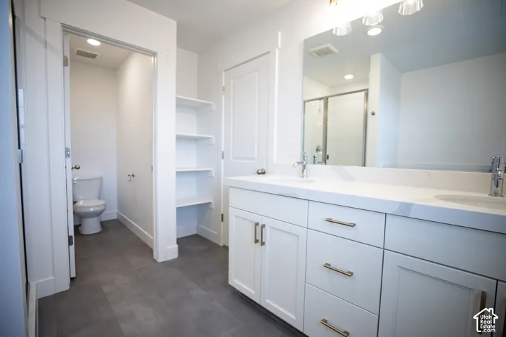 Primary bathroom featuring dual vanity