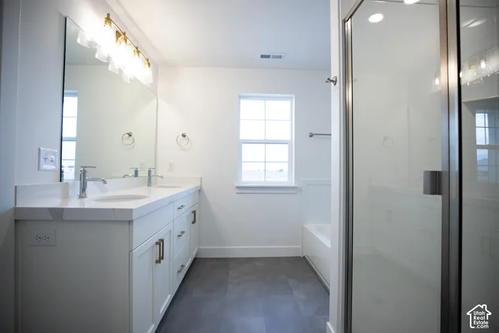 Primary bathroom featuring separate tub and shower