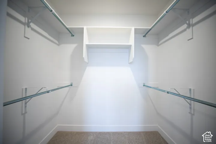 Primary bedroom walk-in closet