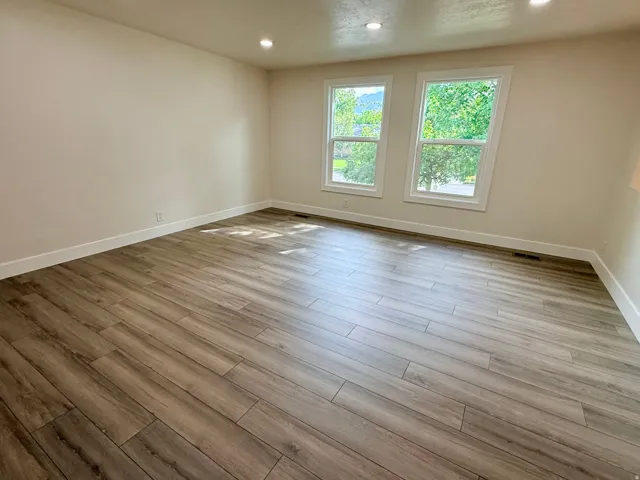 Wood-finish plank flooring throughout