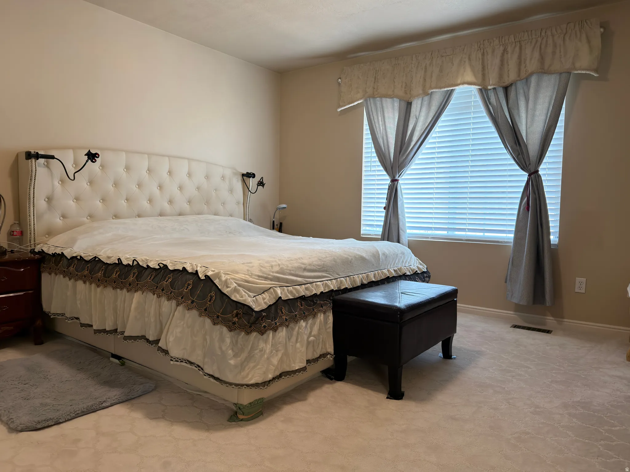 Plush carpet flooring complements neutral wall tones