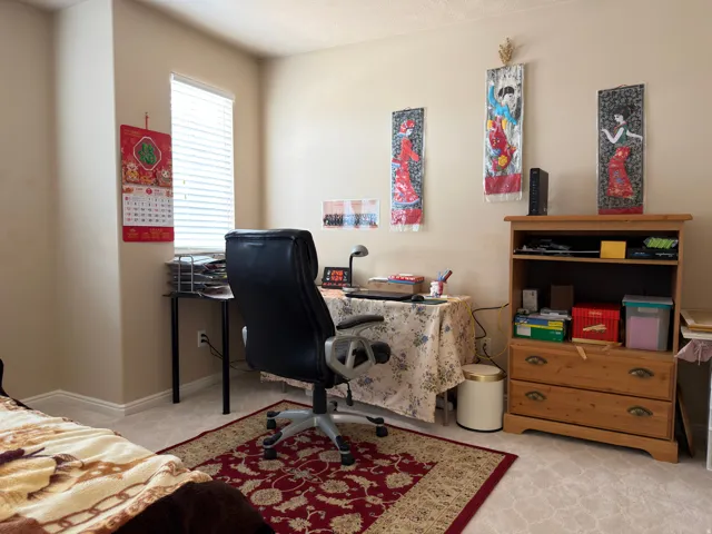 Carpeted flooring, recessed window, light-toned wall paint, and overhead lighting