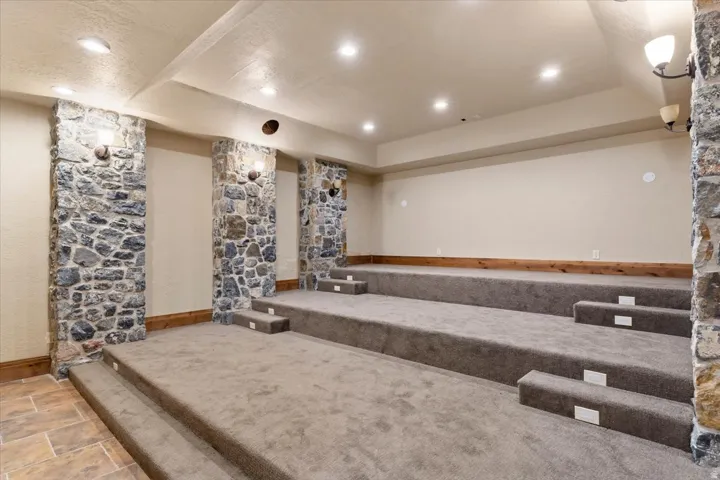 Tiered carpeted seating with integrated step lighting