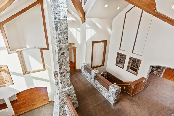 Soaring vaulted ceiling with exposed wood beams