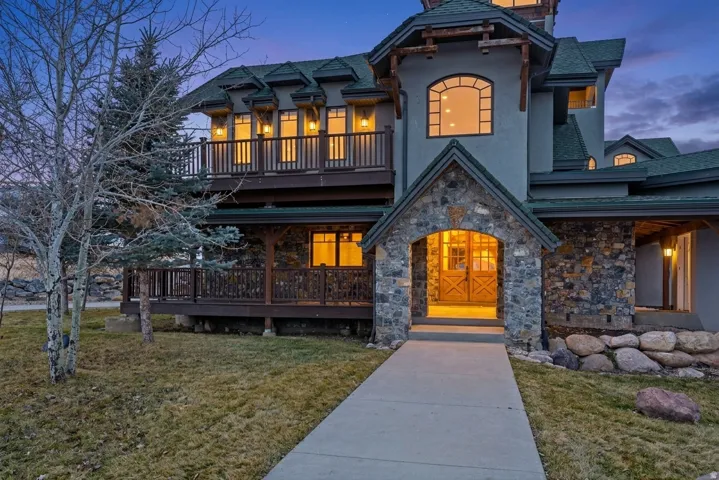 Stone-clad entryway with double wooden doors