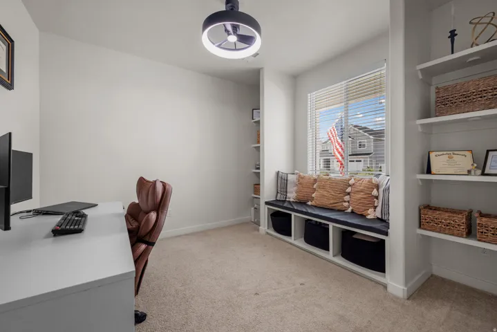 Built-in window bench with storage, integrated shelving, and recessed window