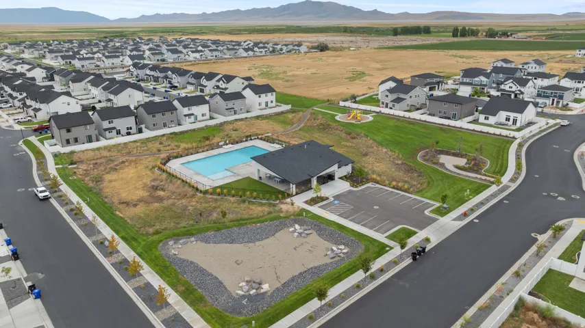 Community features include a swimming pool, clubhouse, parking area, and a green space with playground equipment
