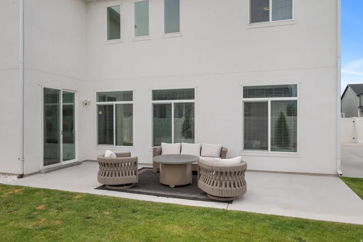 Private concrete patio with direct outdoor access via sliding glass doors