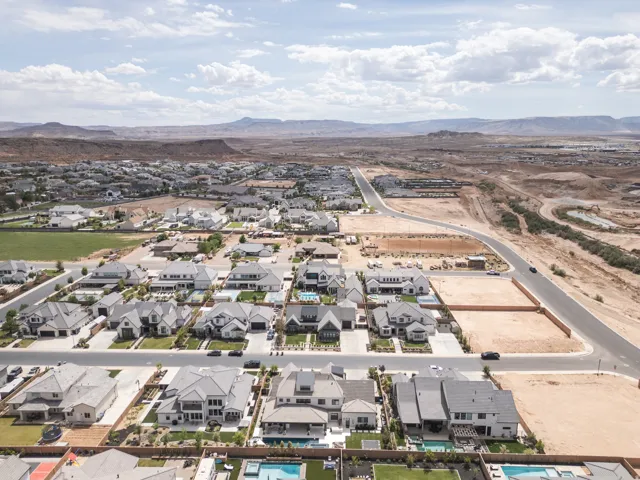 Residential neighborhood featuring a variety of single-family homes, landscaped yards, and private swimming pools
