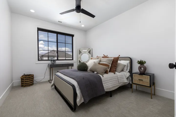 Recessed lighting, ceiling fan, grid-pattern window, light-toned carpeting, and white walls