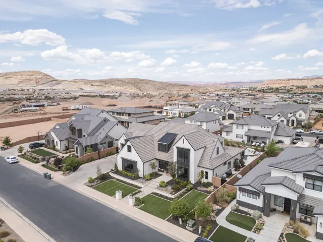 Modern residential architecture with pitched roofs and a neutral color palette