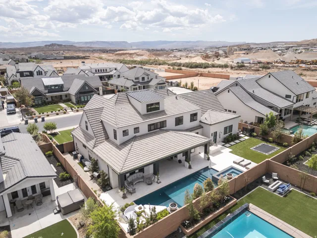 Contemporary exterior with a covered patio, integrated swimming pool, and spa