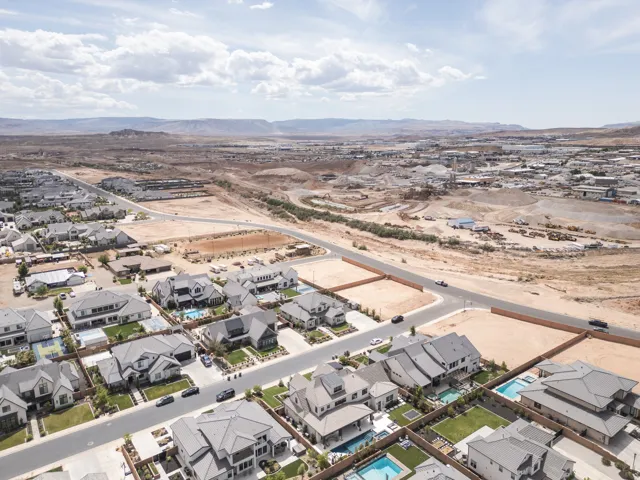 Residential neighborhood with mature homes, new construction, and desert landscaping