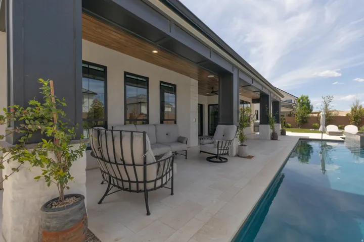 Covered patio with wood-finish ceiling and recessed lighting