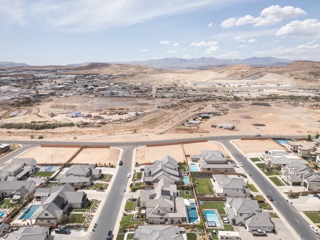 New construction residential community featuring paved streets, landscaped yards, and private swimming pools
