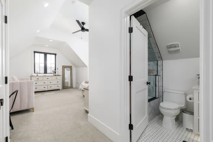 Vaulted ceilings with recessed lighting, black framed window, ceiling fan, and carpeted flooring
