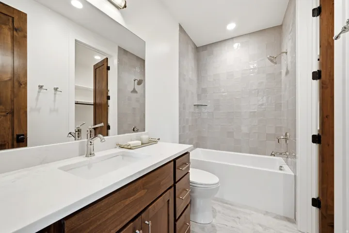 Vanity with integrated rectangular sink and polished chrome faucet