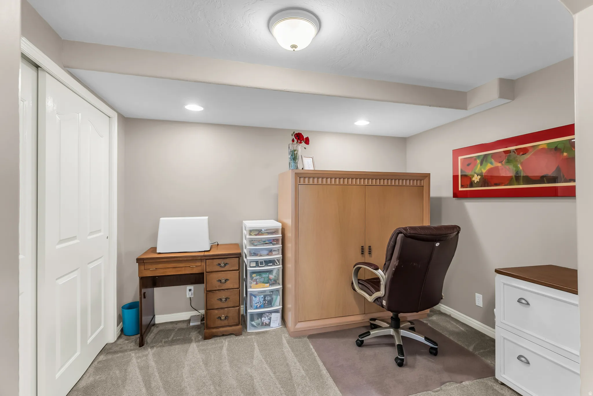 White bi-fold doors, recessed lighting, and a flush mount ceiling fixture illuminate this space