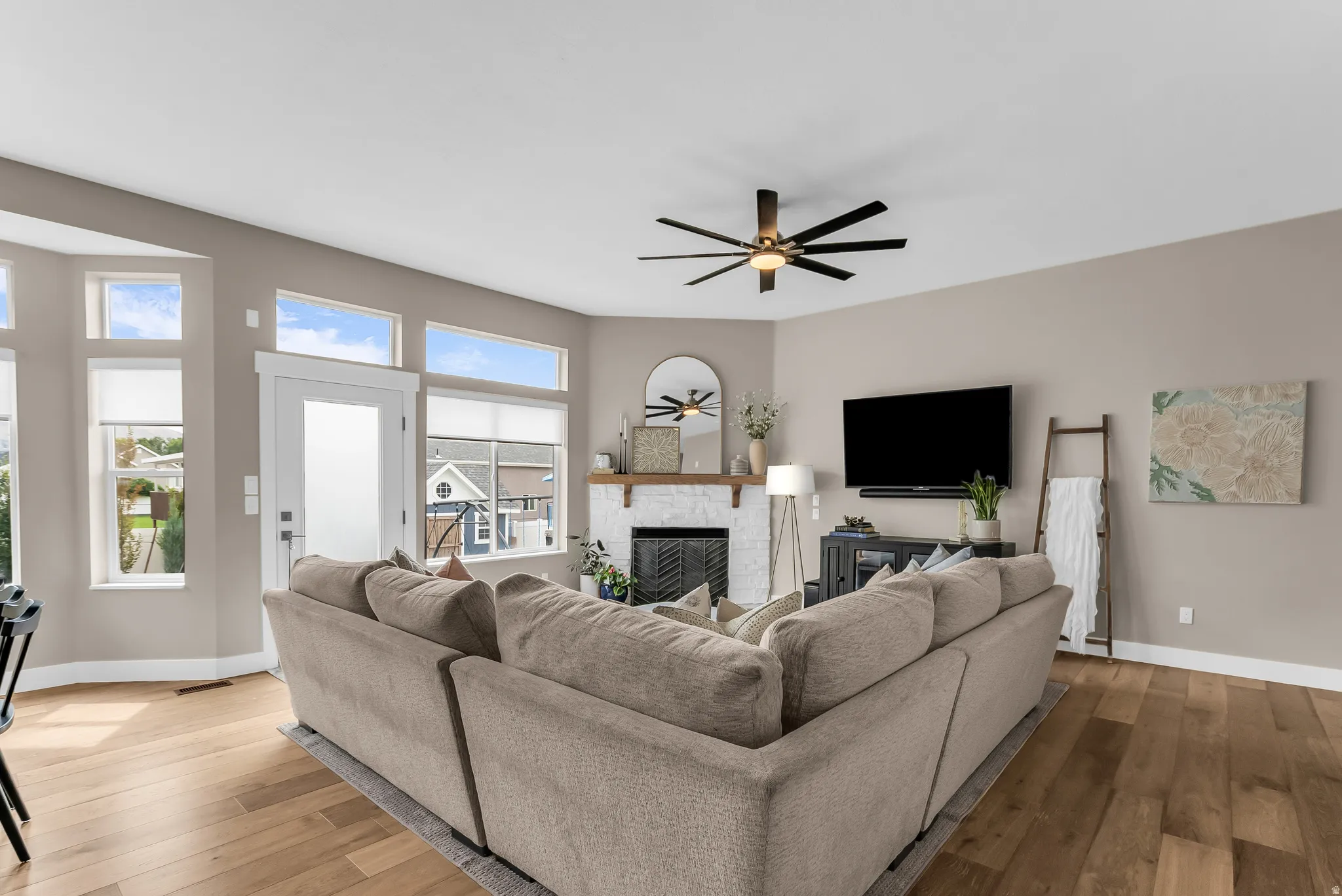 Hardwood-finish flooring, recessed lighting, and a modern ceiling fan