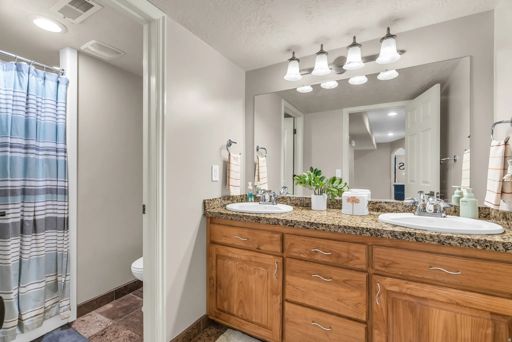 Double vanity with granite countertop and dual undermount sinks