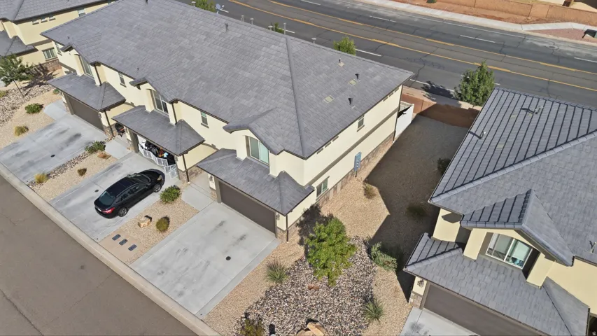 Multi-unit residences featuring a stucco exterior and pitched shingle roofs