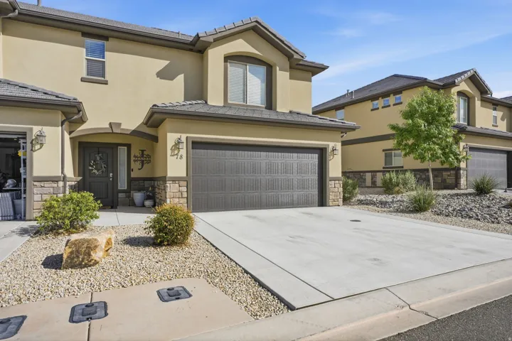 Contemporary exterior with stucco siding and stone accents