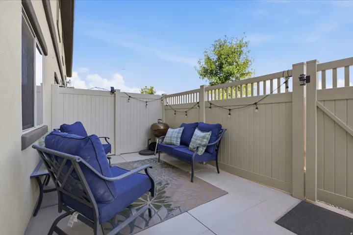 Private outdoor patio with privacy fencing and hardscaping