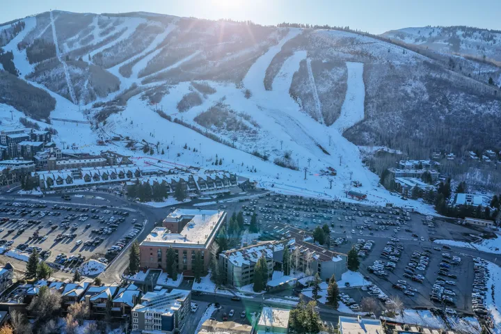 Mountain scenery with snow-covered ski slopes and multiple resort buildings