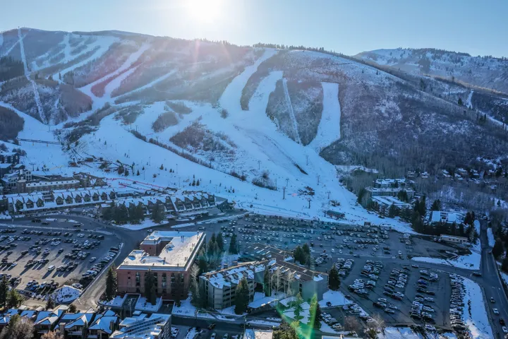 Snow-covered mountain terrain featuring multiple ski runs and ski lifts