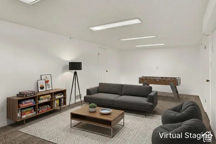 STAGED Recessed lighting, white walls, and New carpet flooring create a versatile interior space