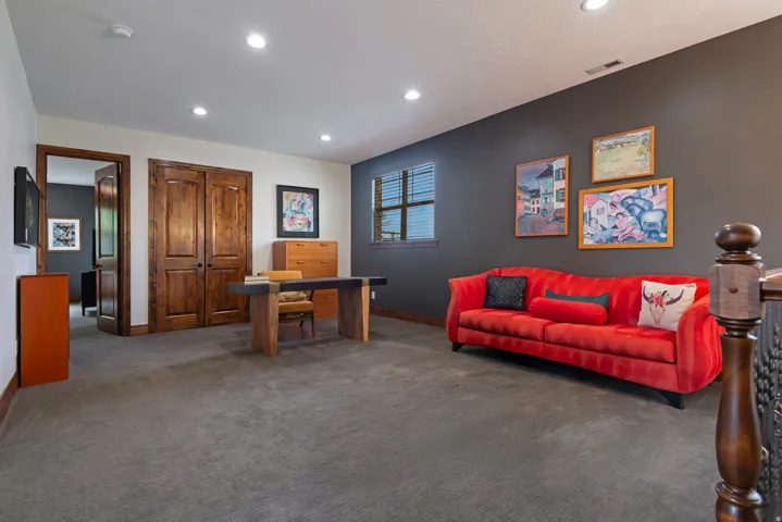 Recessed ceiling lighting, wood-finish doors, and plush carpet flooring