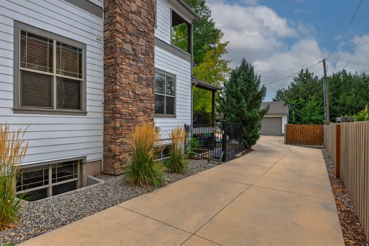 Concrete driveway leading to a detached garage