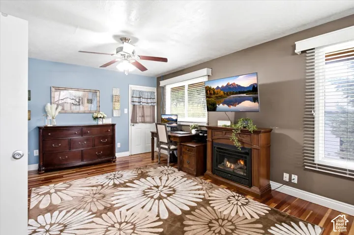 Wood-finish flooring with a ceiling fan with light fixture