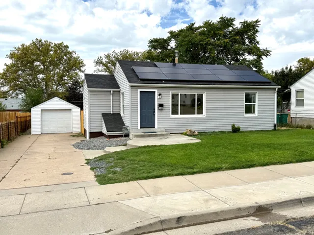 Single-story residence featuring light gray siding and a dark gray roof