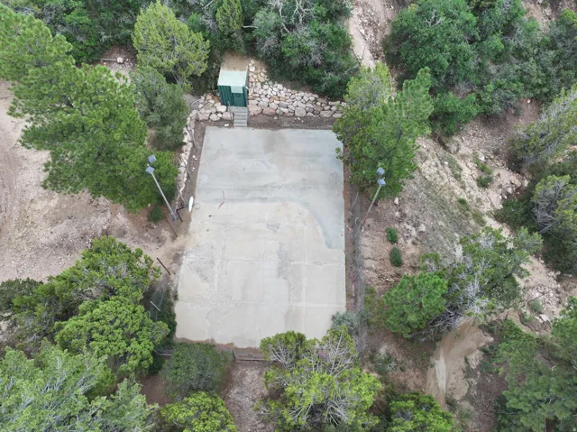 Concrete pad with surrounding natural landscaping