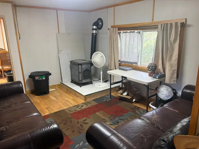 Wood-finish flooring with a decorative area rug