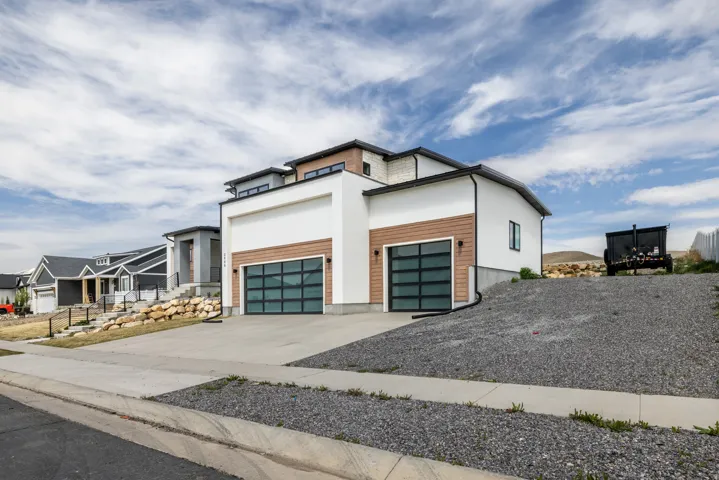 Contemporary exterior with white stucco and wood-finish siding