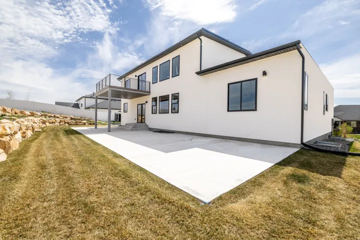 Expansive concrete patio with direct access to the interior