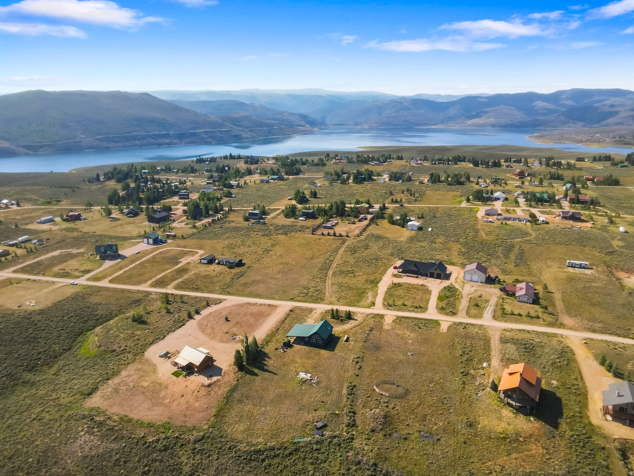 Expansive landscape featuring scattered homes and substantial undeveloped land