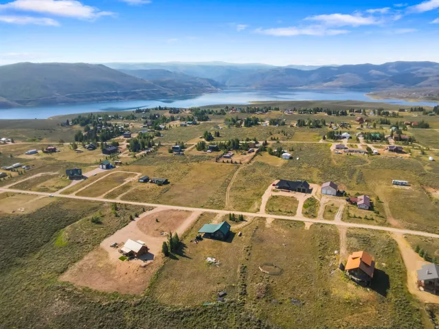 Expansive landscape featuring scattered homes and substantial undeveloped land